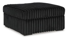FURRY OTTOMAN IN BLACK